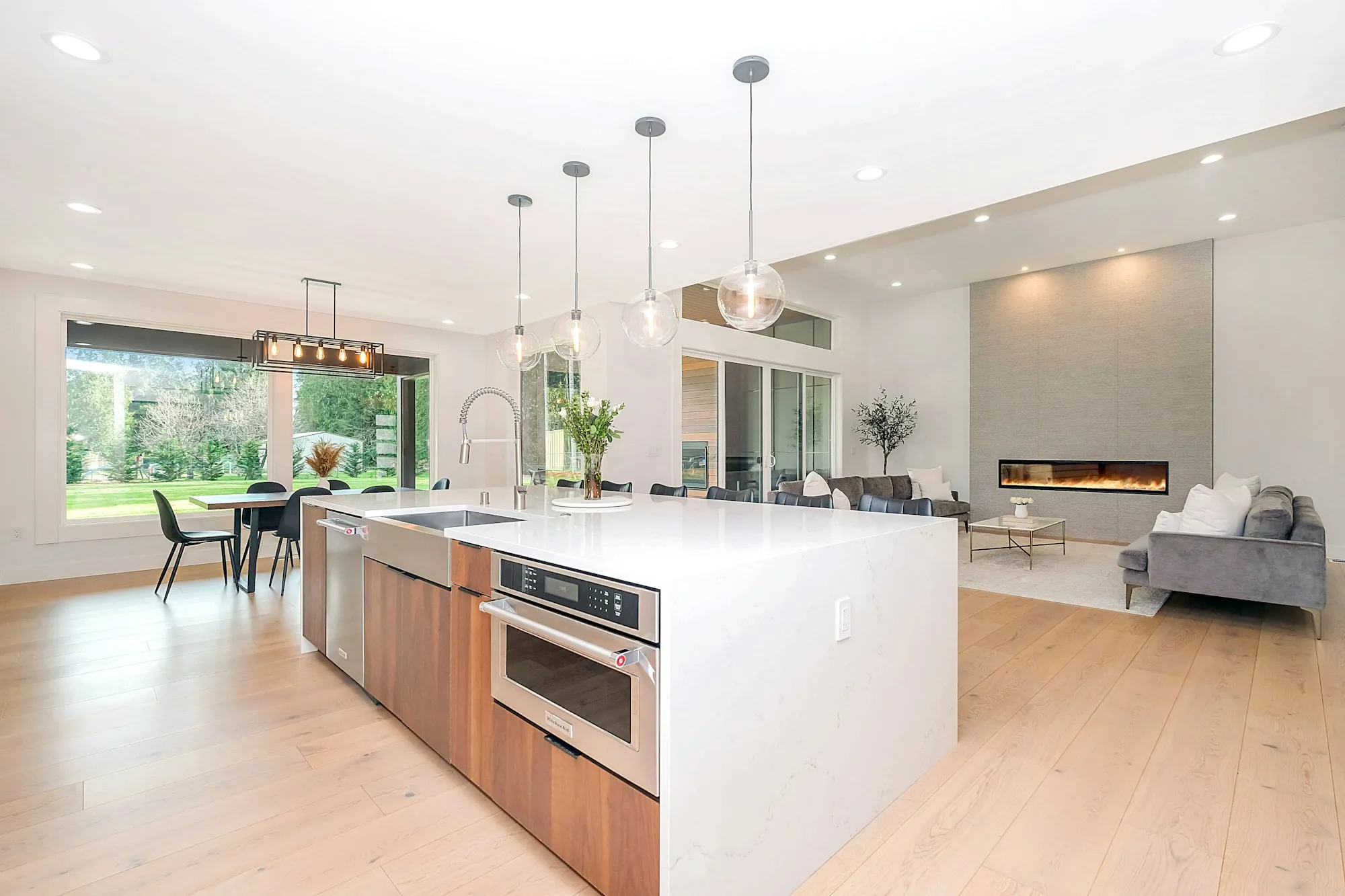 An open-plan living space lit by recessed lighting